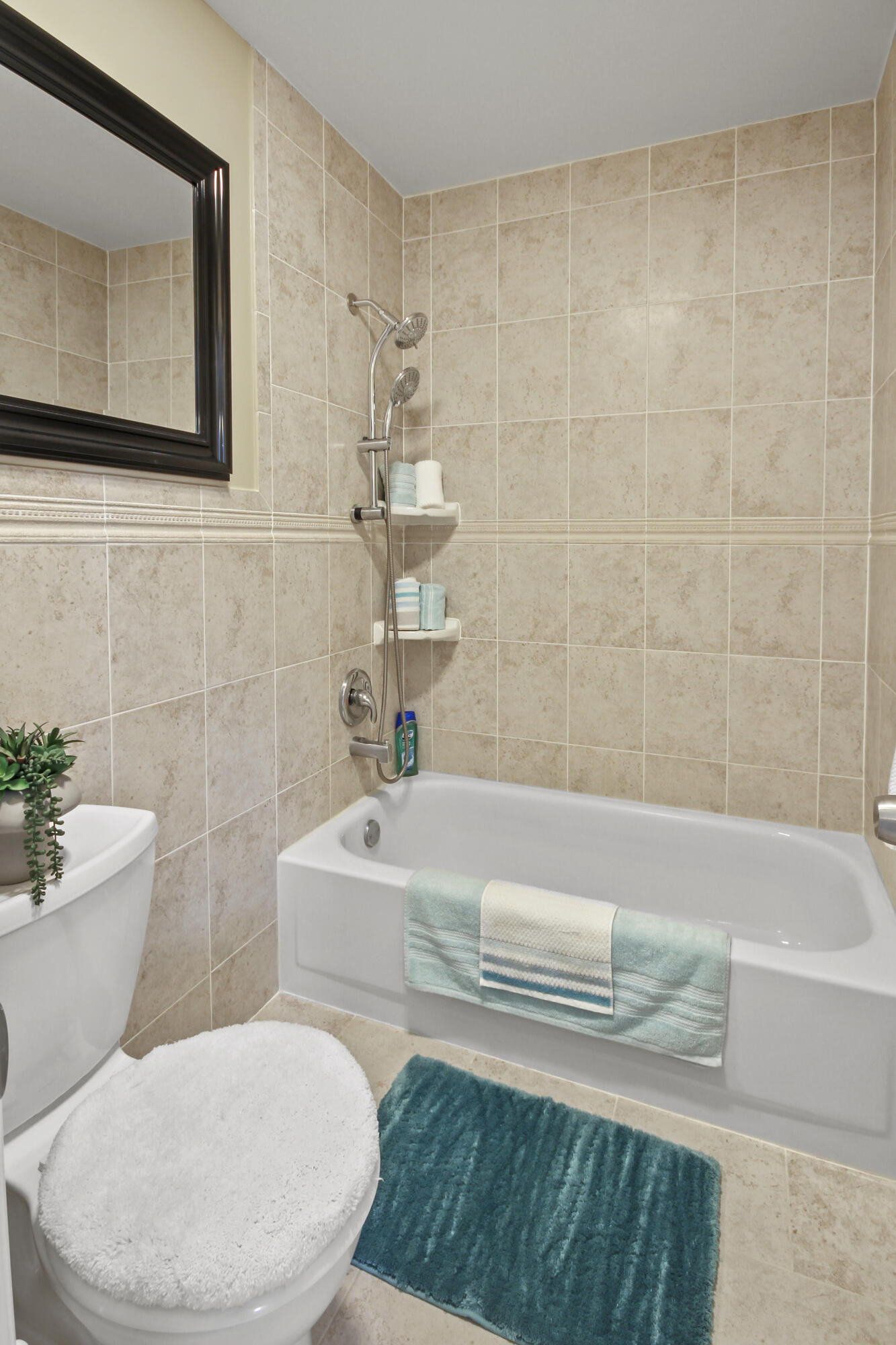 1421 Northwest 20th Avenue, Unit 204 Delray Beach, FL 33445 - Photo 20 of 22 a bathroom with a sink a toilet and bathtub