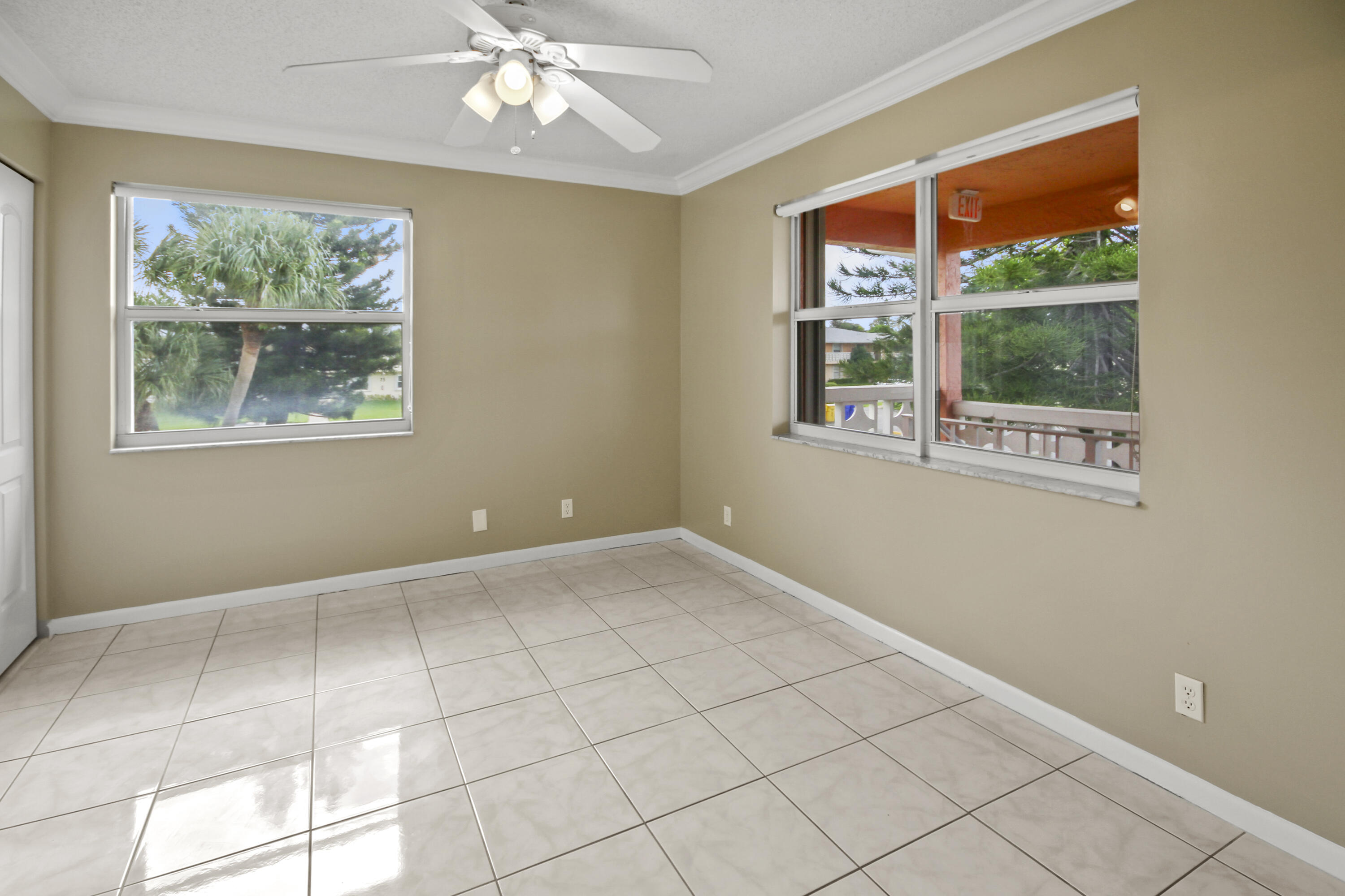 1421 Northwest 20th Avenue, Unit 204 Delray Beach, FL 33445 - Photo 8 of 22 a view of an empty room with a window