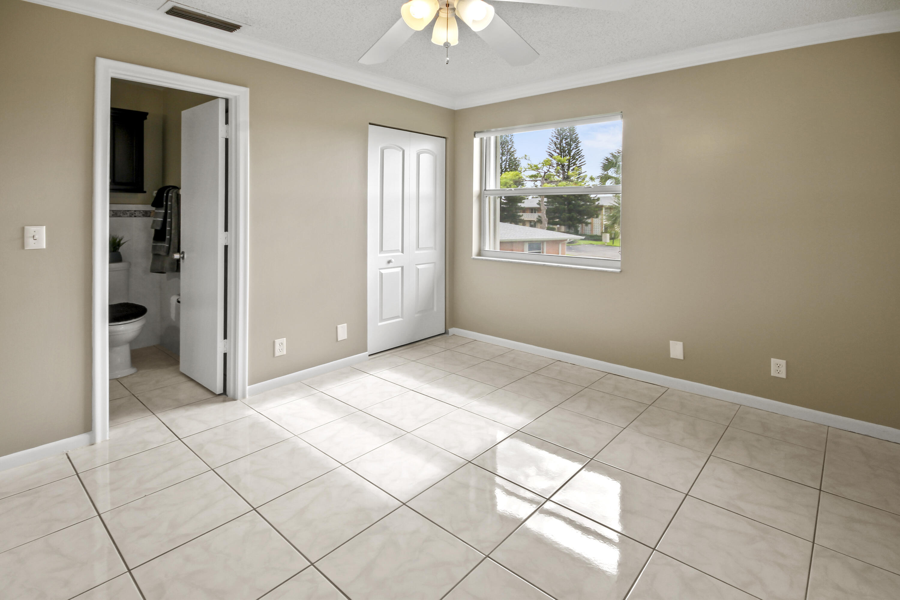 1421 Northwest 20th Avenue, Unit 204 Delray Beach, FL 33445 - Photo 9 of 22 a view of livingroom with window