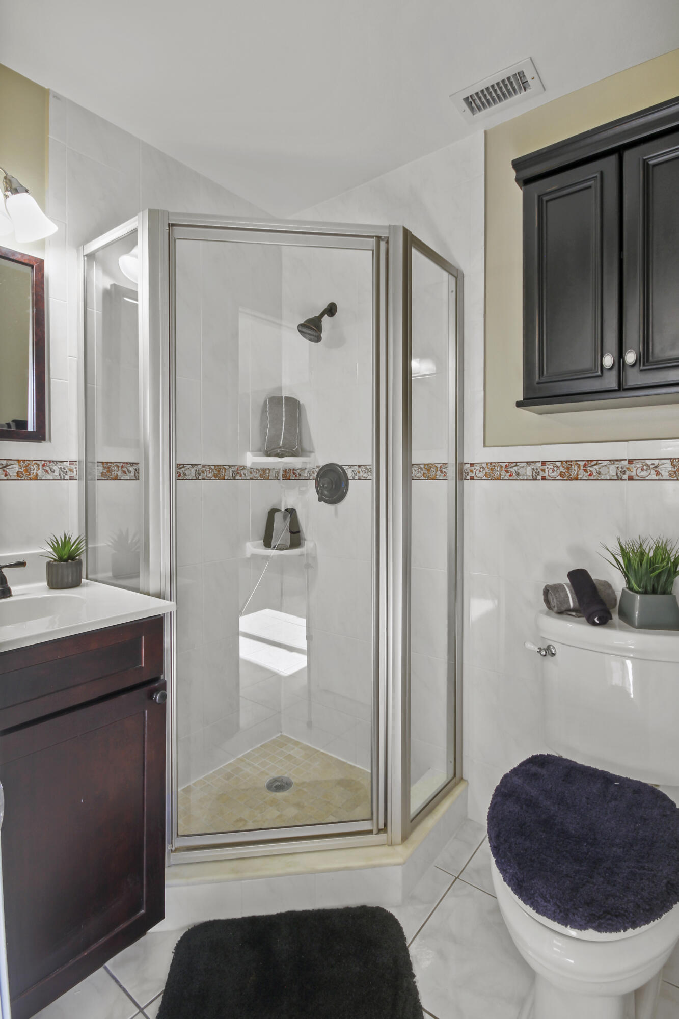 1421 Northwest 20th Avenue, Unit 204 Delray Beach, FL 33445 - Photo 10 of 22 a bathroom with a sink a toilet and shower