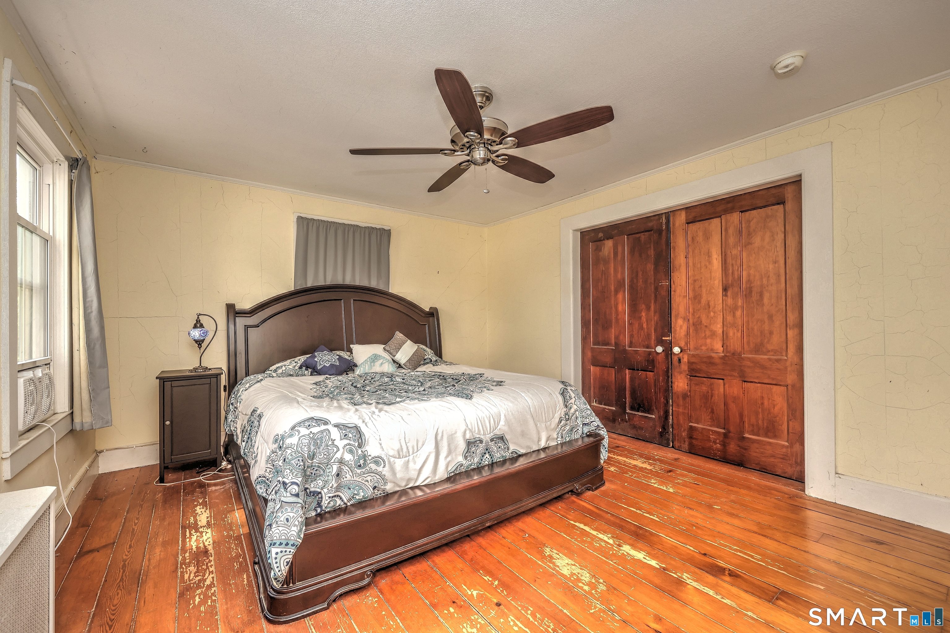 186 Jones Hill Road West Haven, CT 06516 - Photo 22 of 33 a bedroom with a bed and window