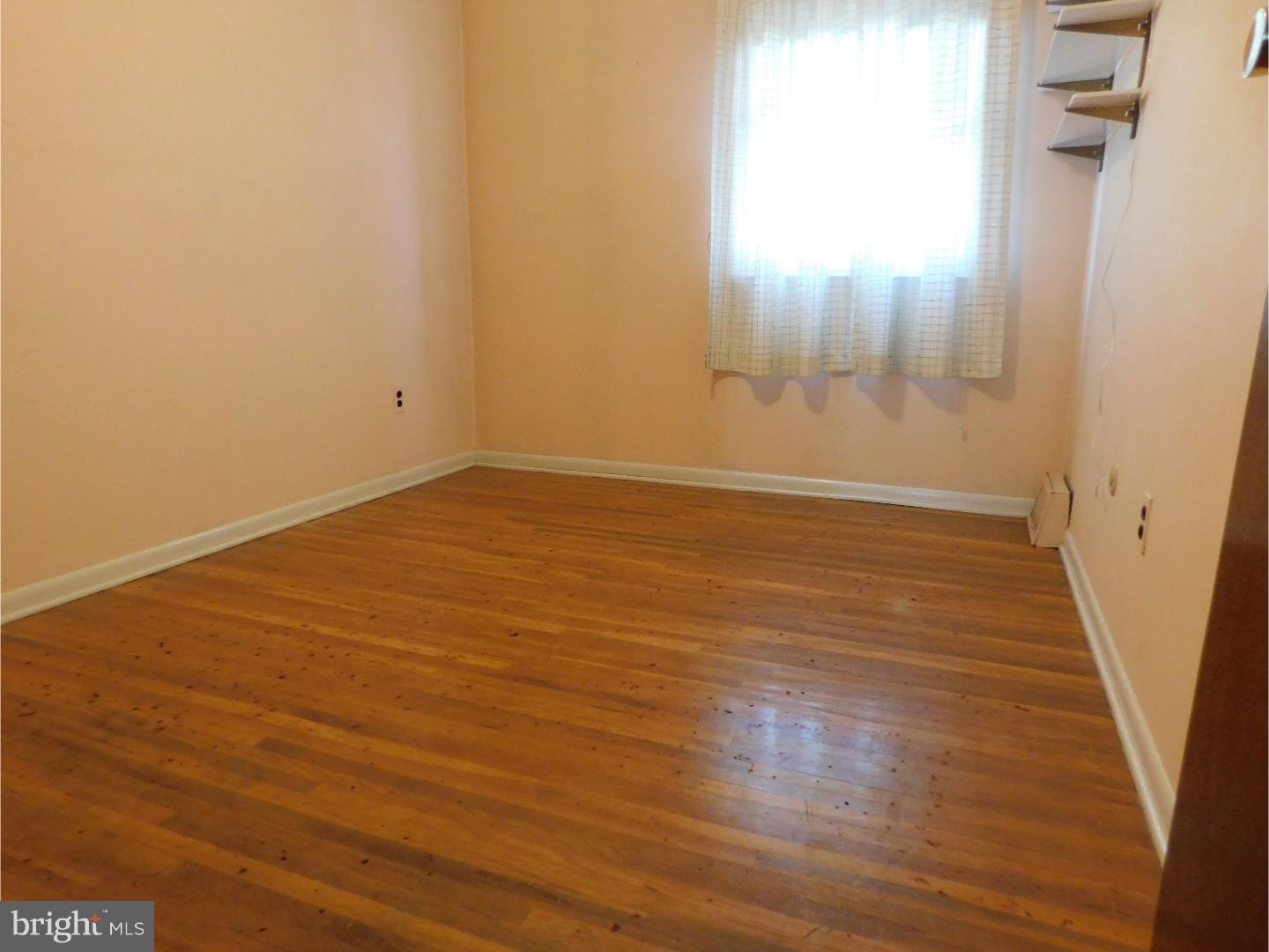 3324 Lester Road Philadelphia, PA 19154 - Photo 14 of 21 an empty room with wooden floor and windows