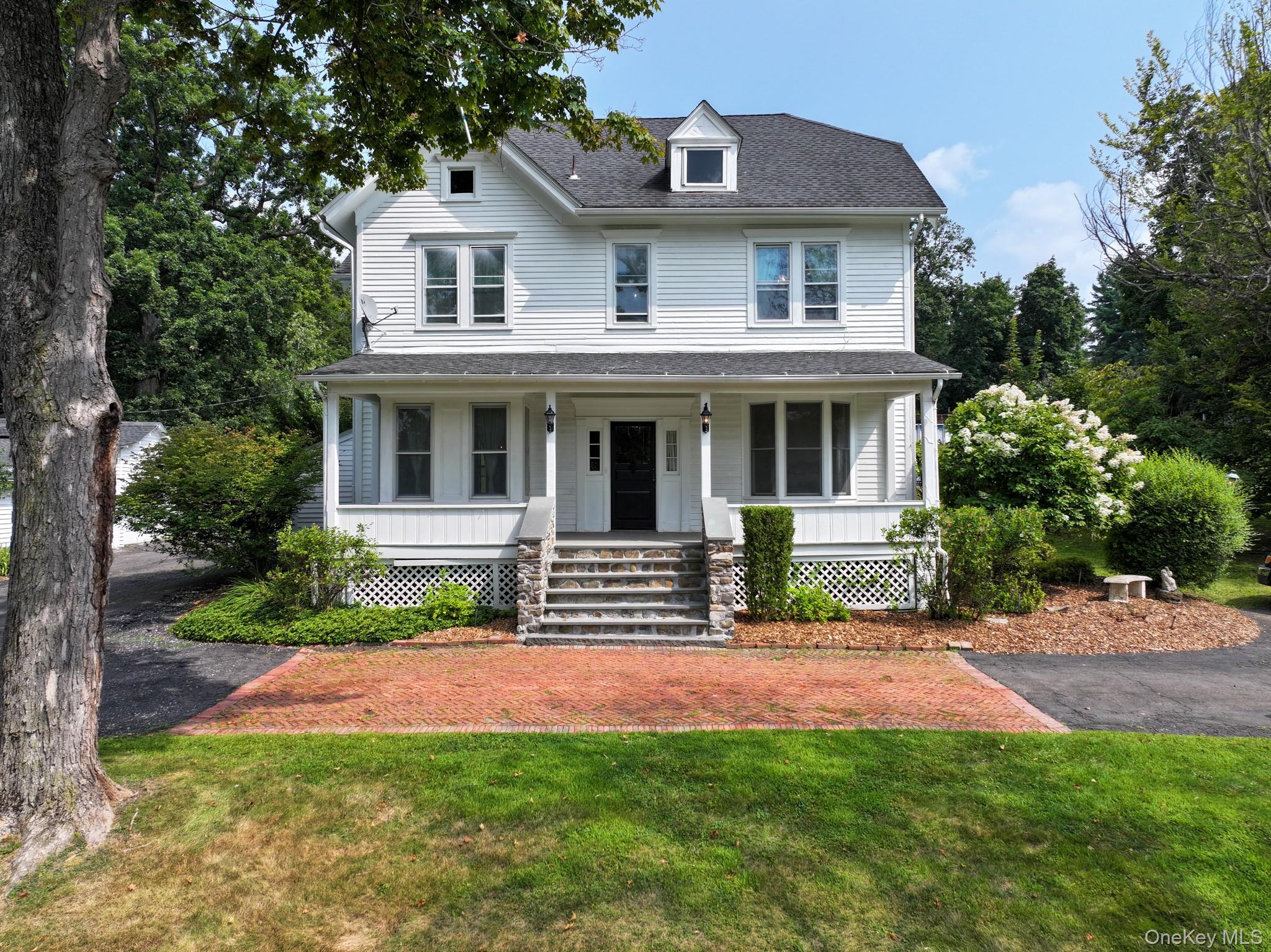 a view of house with a yard