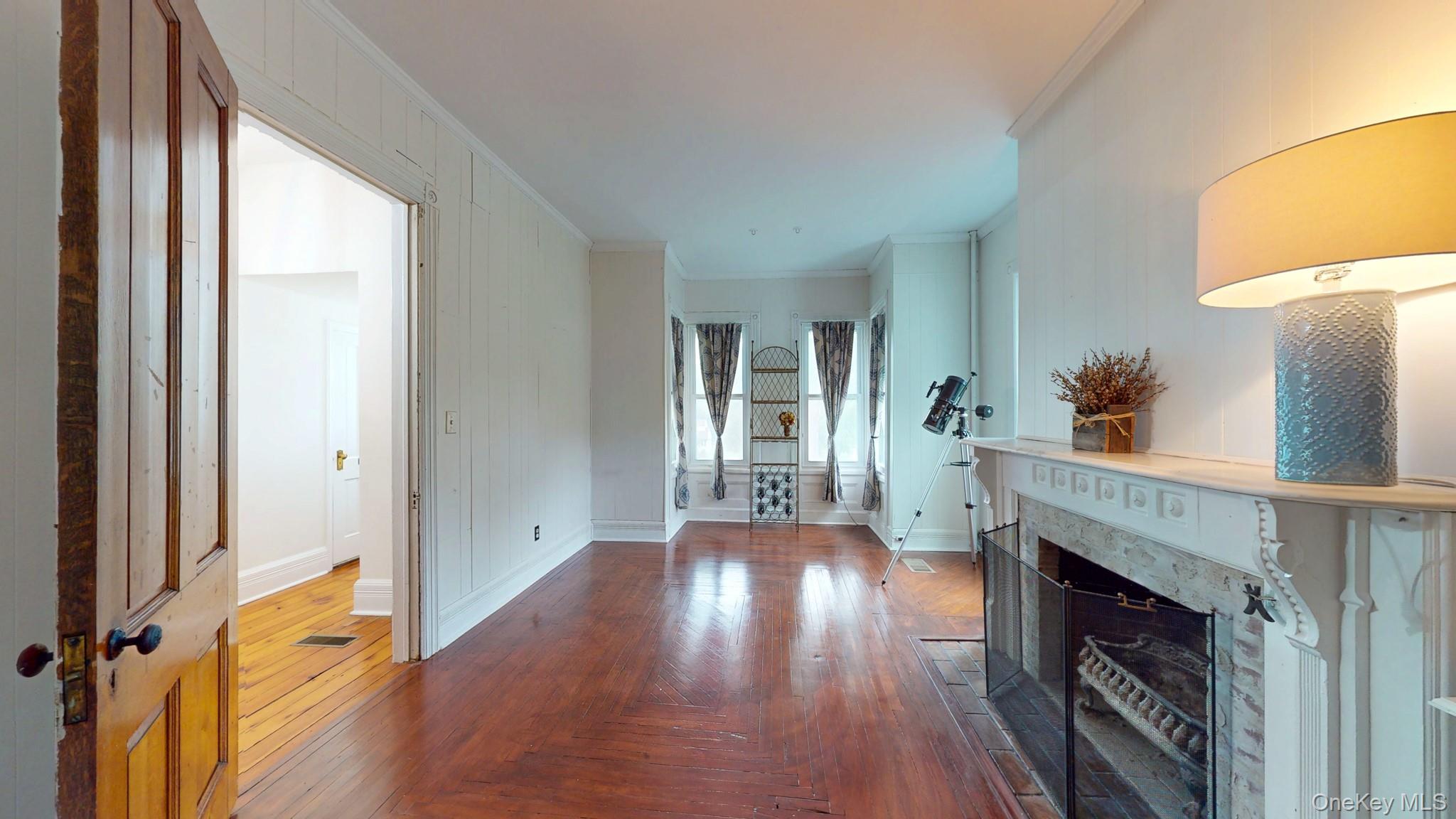12 Perry Creek Road Washingtonville, NY 10992 - Photo 16 of 50 a view of a livingroom with wooden floor and a fireplace