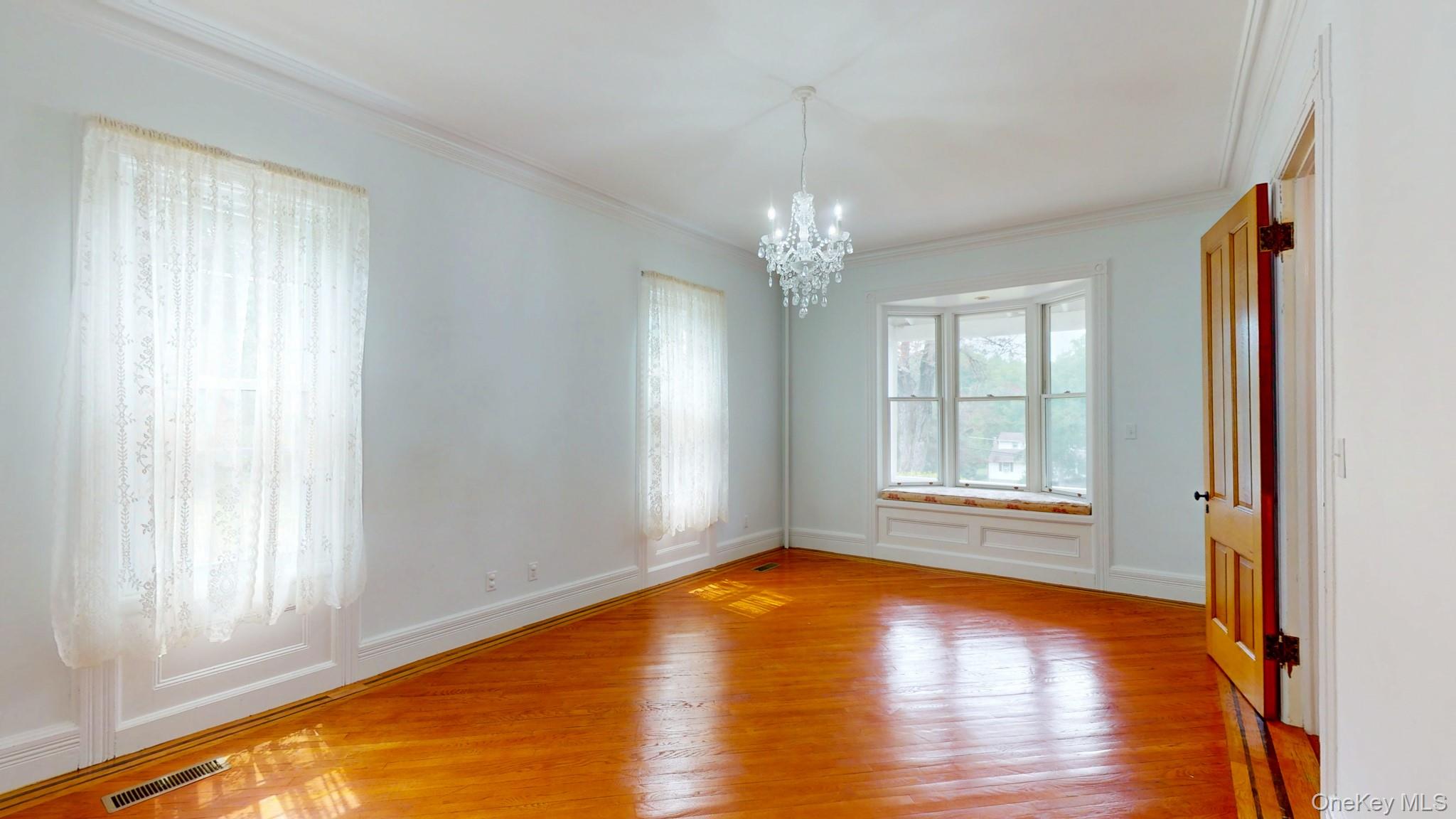 12 Perry Creek Road Washingtonville, NY 10992 - Photo 17 of 50 a view of an empty room with wooden floor and a window