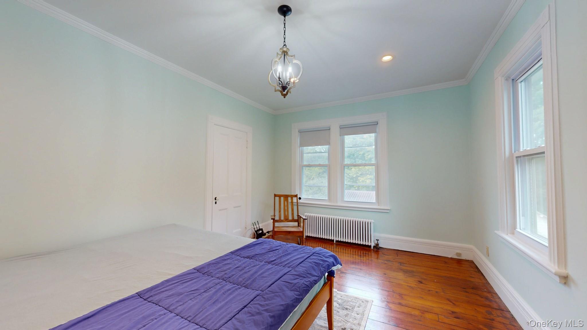 12 Perry Creek Road Washingtonville, NY 10992 - Photo 27 of 50 a view of a room with wooden floor chandelier and windows