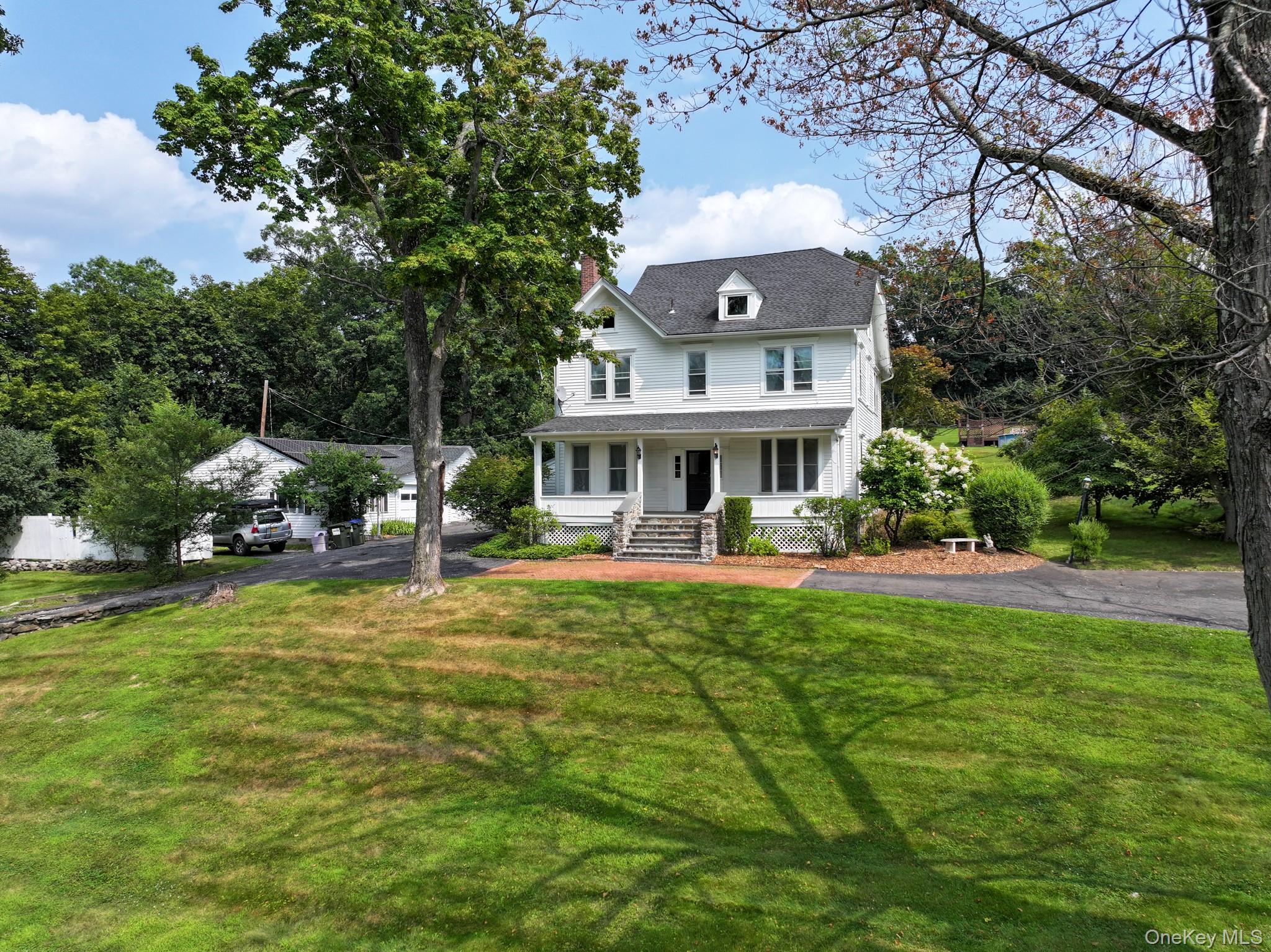 12 Perry Creek Road Washingtonville, NY 10992 - Photo 3 of 50 a front view of house with yard and trees in the background