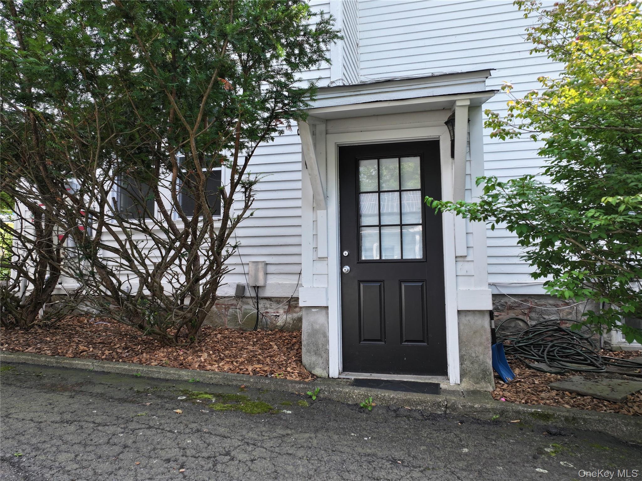 12 Perry Creek Road Washingtonville, NY 10992 - Photo 32 of 50 a front view of a house with a garden