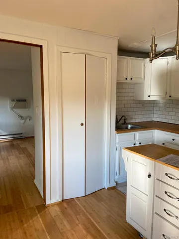 a kitchen with stainless steel appliances a stove a sink and a refrigerator