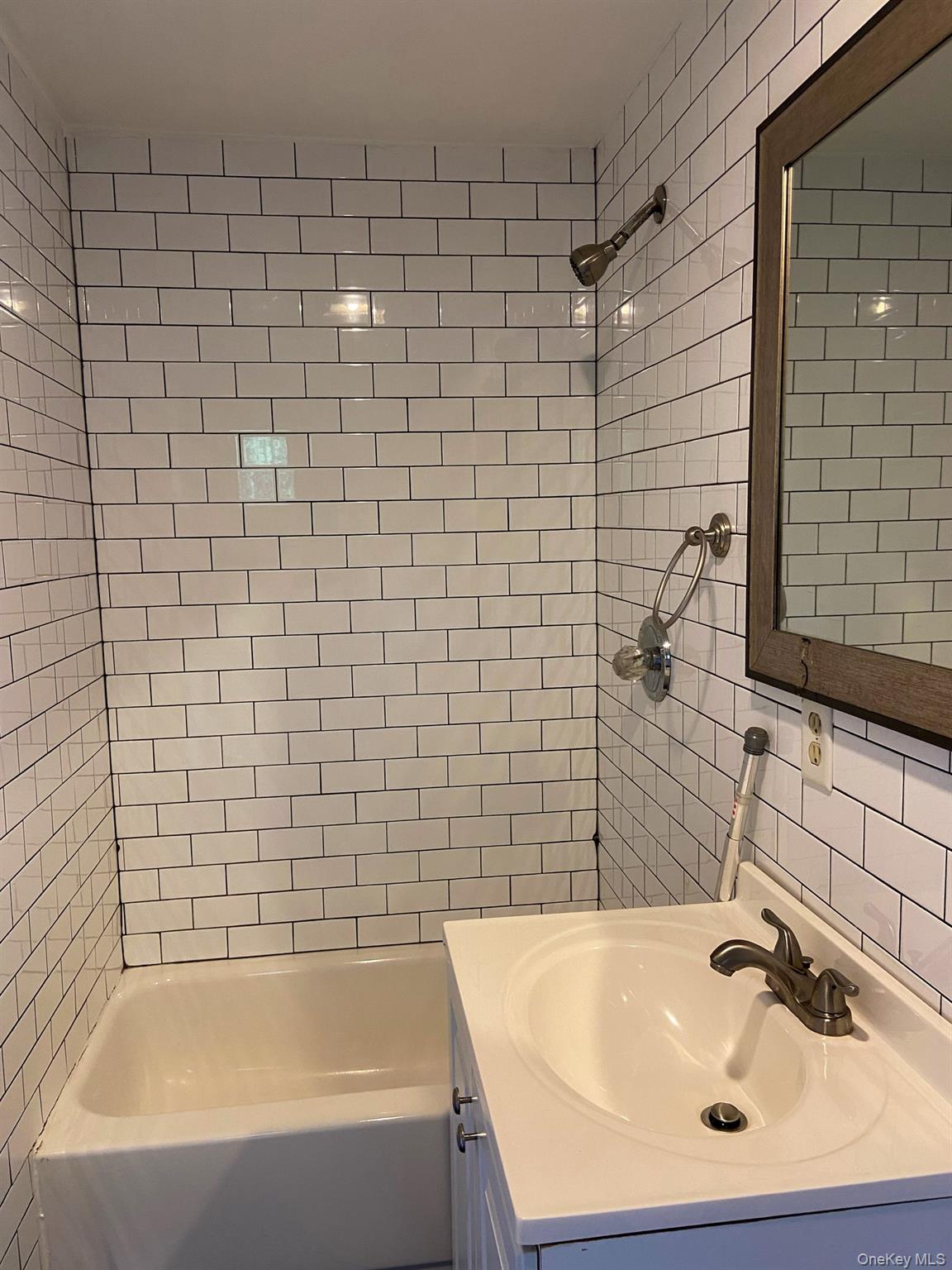 12 Perry Creek Road Washingtonville, NY 10992 - Photo 50 of 50 a bathroom with a sink and bathtub