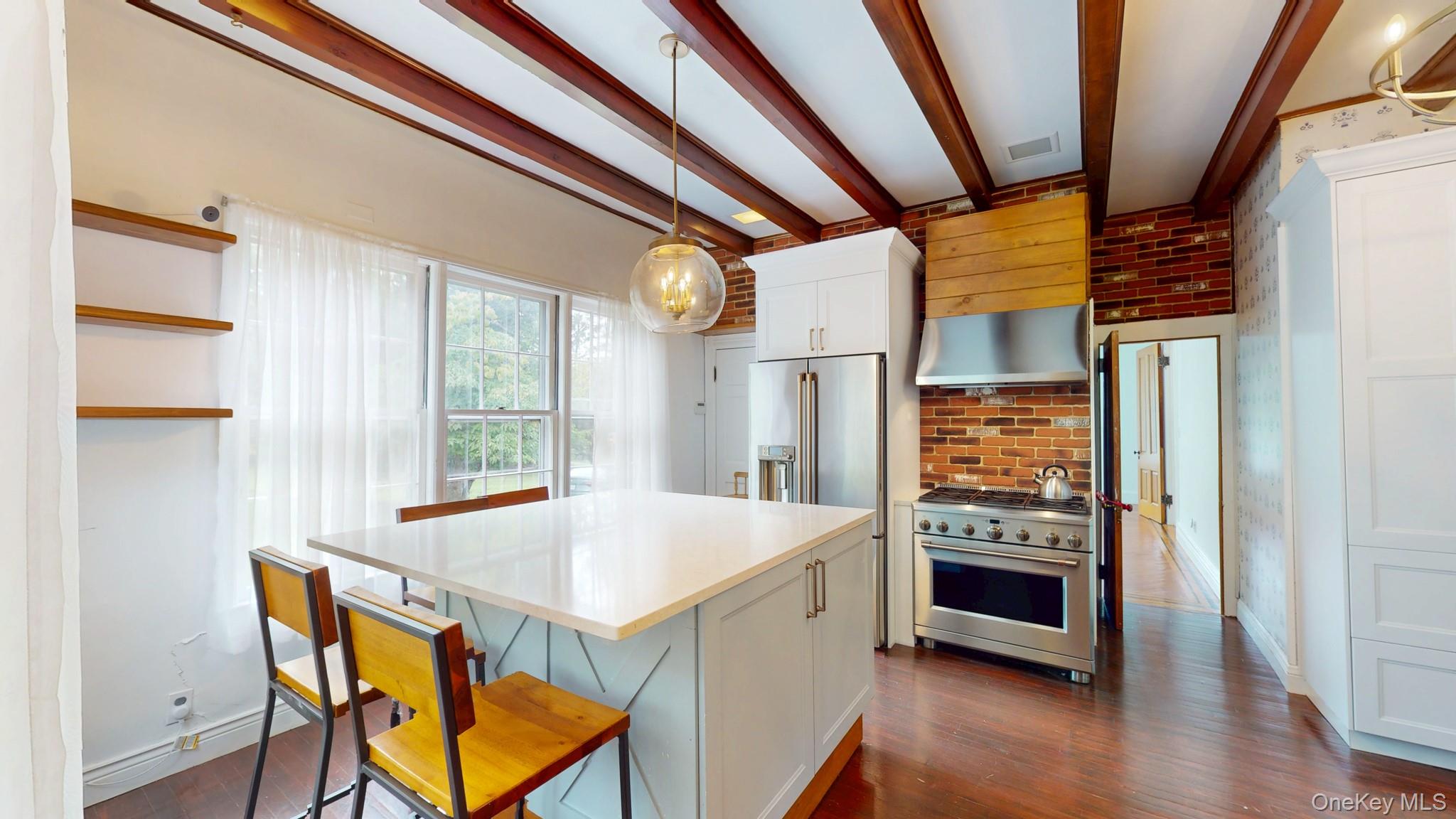 12 Perry Creek Road Washingtonville, NY 10992 - Photo 9 of 50 a kitchen with stainless steel appliances kitchen island granite countertop a refrigerator a stove and a wooden floors