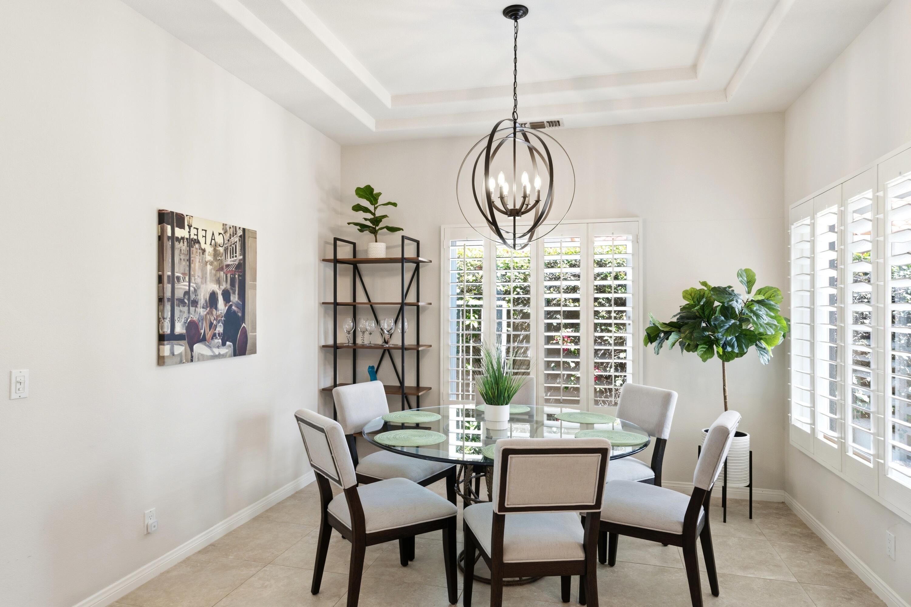 39 Augusta Drive Rancho Mirage, CA 92270 - Photo 15 of 53 a view of a dining room with furniture window and wooden floor