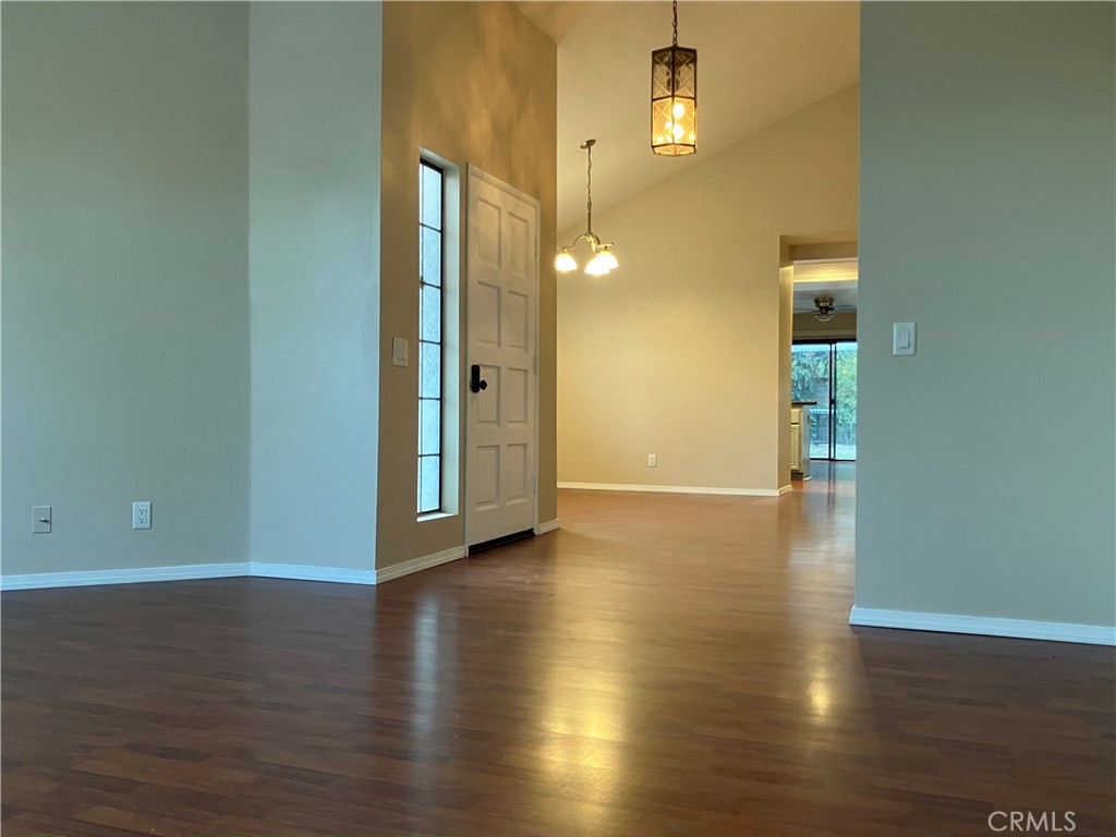 19933 Ralph Street Walnut, CA 91789 - Photo 9 of 77 an empty room with wooden floor and windows