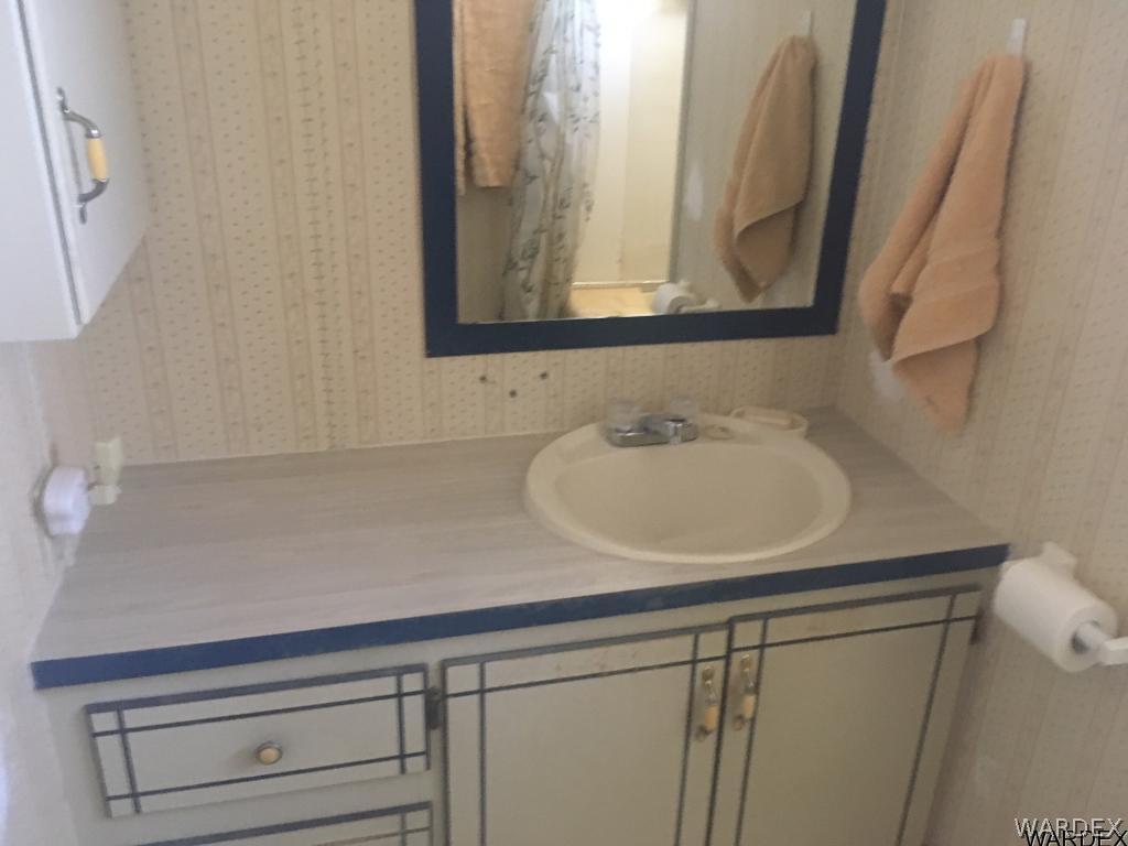 1652 Gran Circulo Fort Mohave, AZ 86426 - Photo 7 of 15 a bathroom with a sink and a mirror