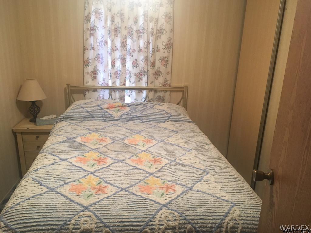 1652 Gran Circulo Fort Mohave, AZ 86426 - Photo 10 of 15 a bed sitting in a bedroom next to a window