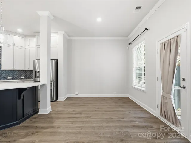a view of a kitchen with a sink and a window