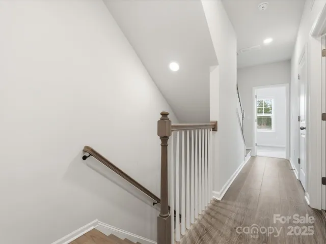 wooden floor in a hall with a window