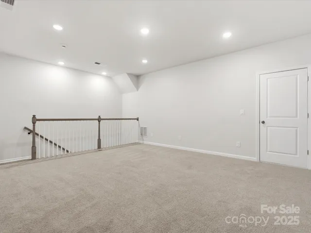 an empty room with white walls and white walls