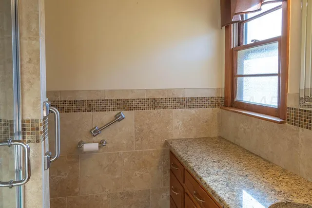 a view of a bathroom with a sink and a window