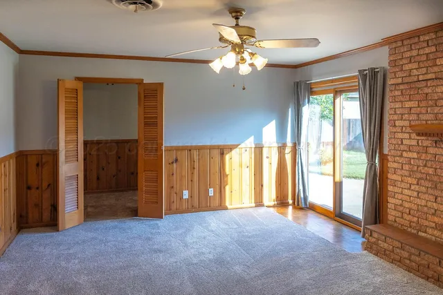 a view of an empty room with a window