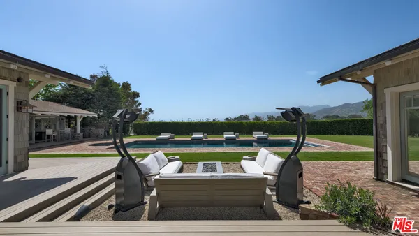 an outdoor view of the patio and swimming pool