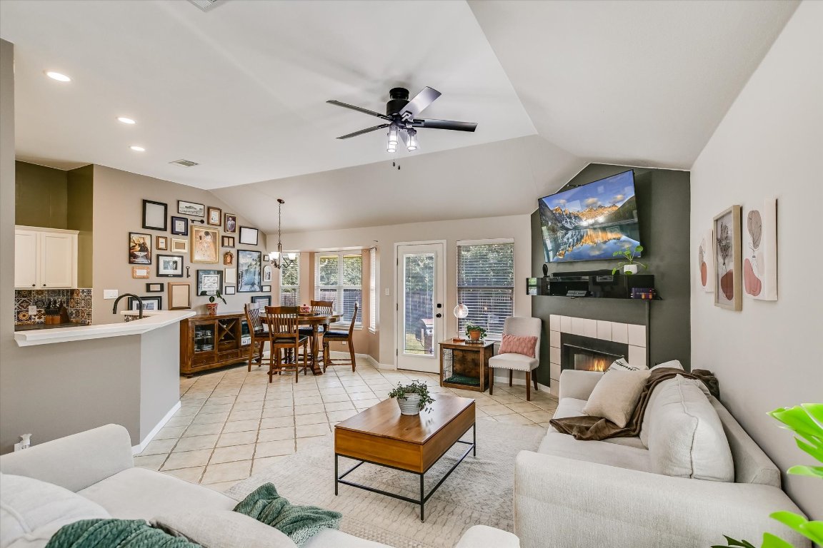 1302 Redbud Lane Leander, TX 78641 - Photo 11 of 28 a living room with fireplace furniture and a flat screen tv