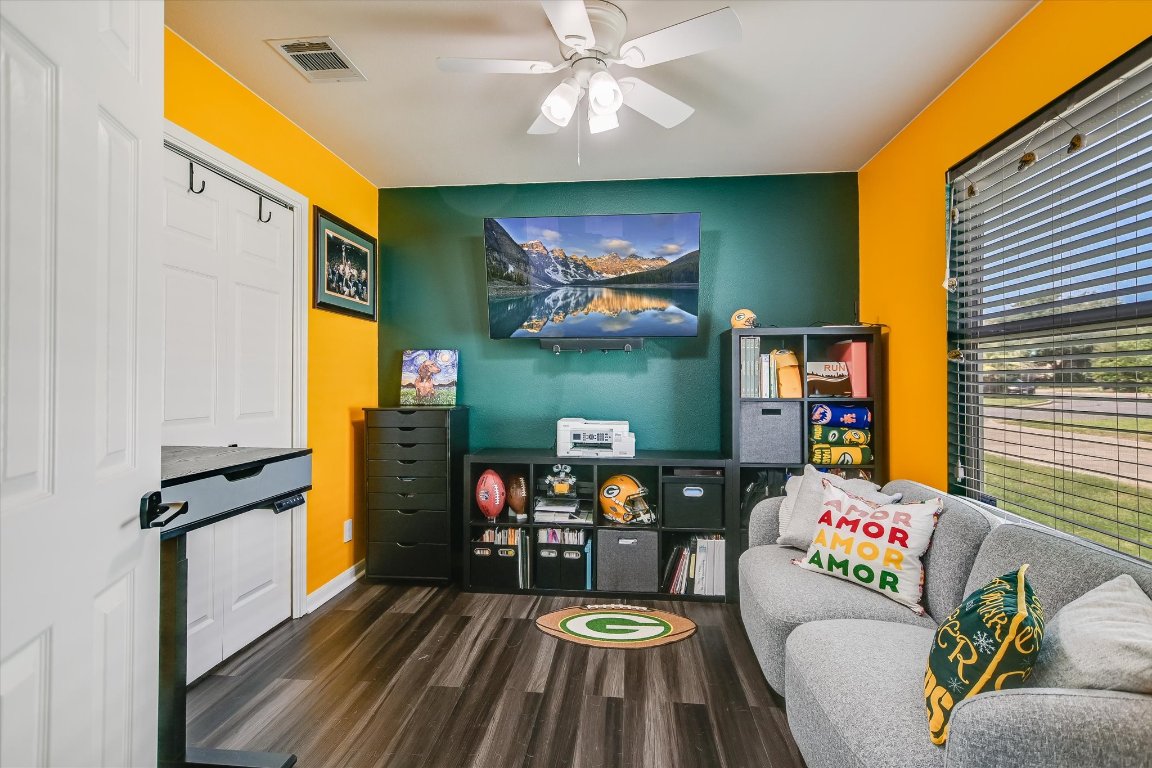 1302 Redbud Lane Leander, TX 78641 - Photo 18 of 28 a living room with furniture and a flat screen tv
