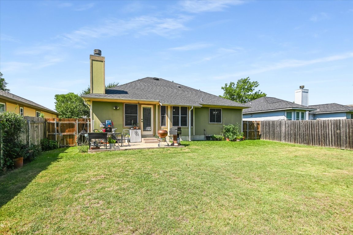 1302 Redbud Lane Leander, TX 78641 - Photo 2 of 28 a front view of house with yard barbeque and outdoor seating