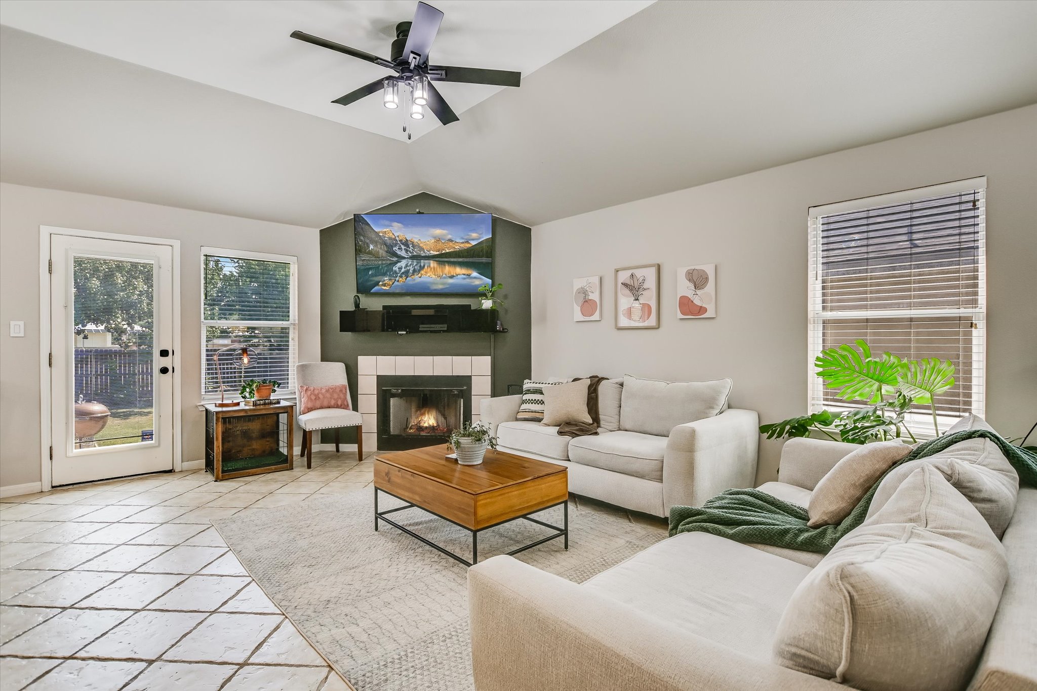 1302 Redbud Lane Leander, TX 78641 - Photo 22 of 28 a living room with furniture a fireplace and a flat screen tv