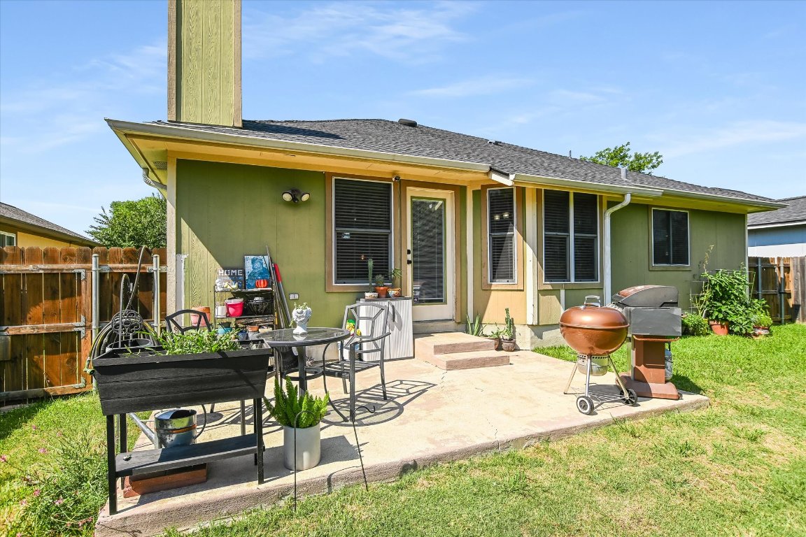 1302 Redbud Lane Leander, TX 78641 - Photo 23 of 28 a view of a house with backyard sitting area and garden