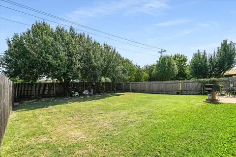 a swimming pool with wooden fence