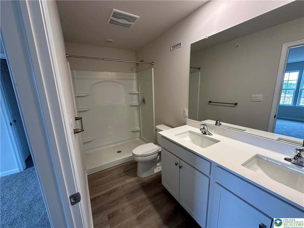 1145 Martin Road Breinigsville, PA 18031 - Photo 27 of 38 A well-appointed bathroom with a dual vanity, sleek counters, and modern fixtures.