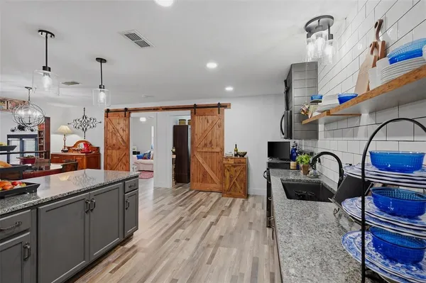 a kitchen with kitchen island granite countertop lots of counter top space