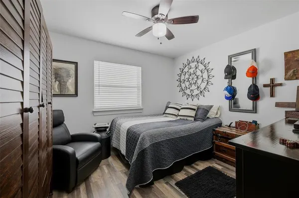 a bedroom with bed and furniture