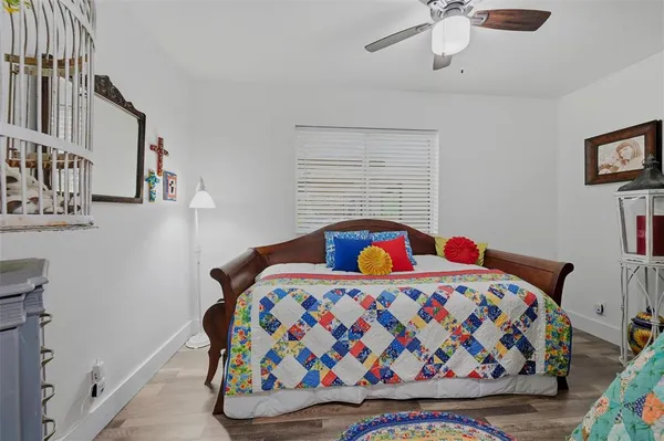 a bedroom with a bed and dresser