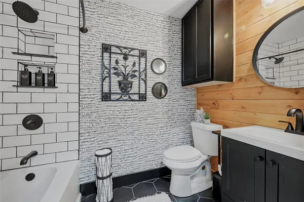 a bathroom with a toilet and a sink
