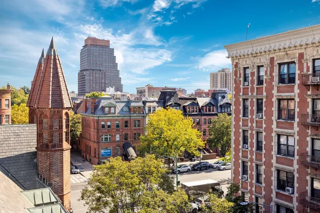 a view of a city with tall buildings
