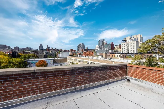 a stove top oven sitting inside of a kitchen