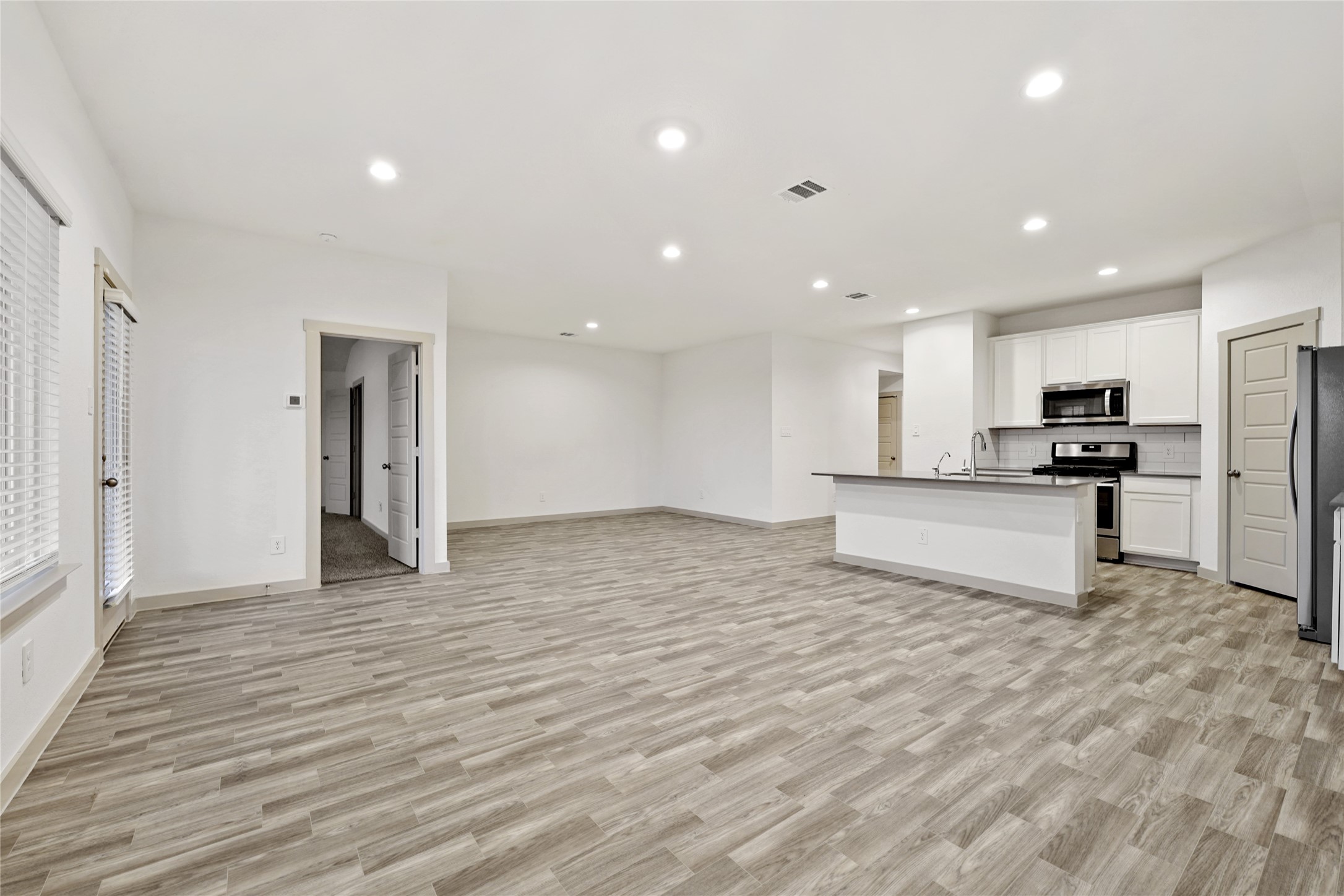 714 Boer Plains Drive Rosharon, TX 77583 - Photo 8 of 11 a view of kitchen with wooden floor
