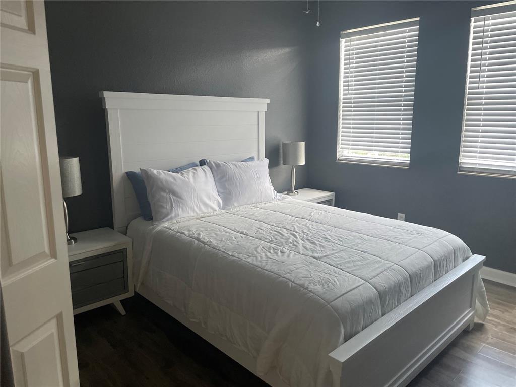 10690 OldHammock Way Wellington, FL 33414 - Photo 8 of 9 a bedroom with a bed and a window