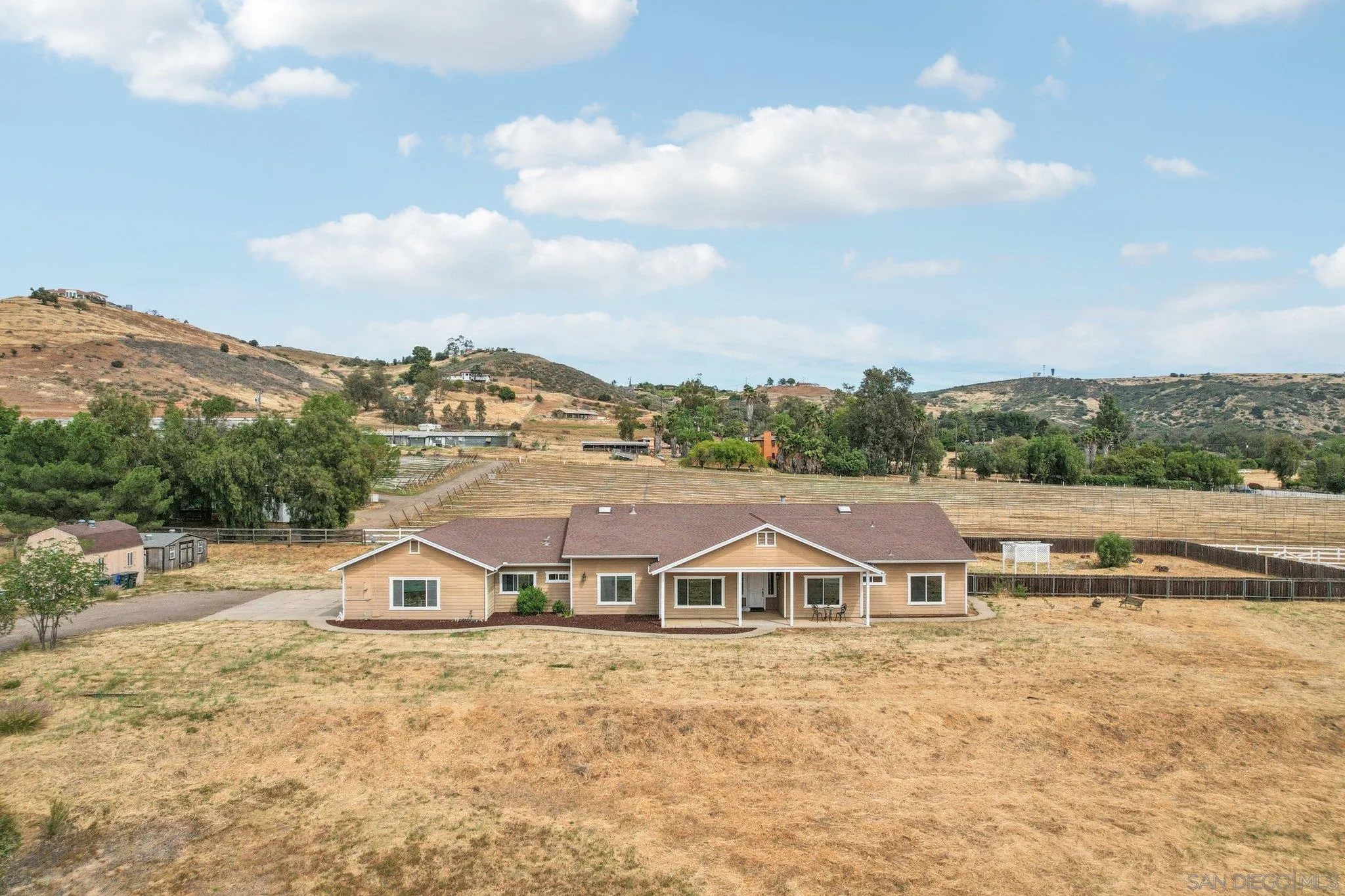 1346 Wilson Road Ramona, CA 92065 - Photo 4 of 71 Ramona horse property, Property is one spacious single level home, with 9 foot ceilings, cathedral ceilings in the living room, 36 inch hallways, wide doors, skylights in the hallway, laundry room, with a large office/game room/ exercise room/ you choose