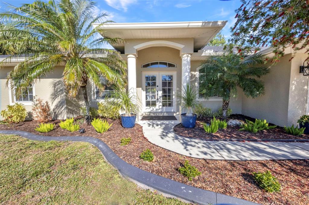 a front view of a house with garden