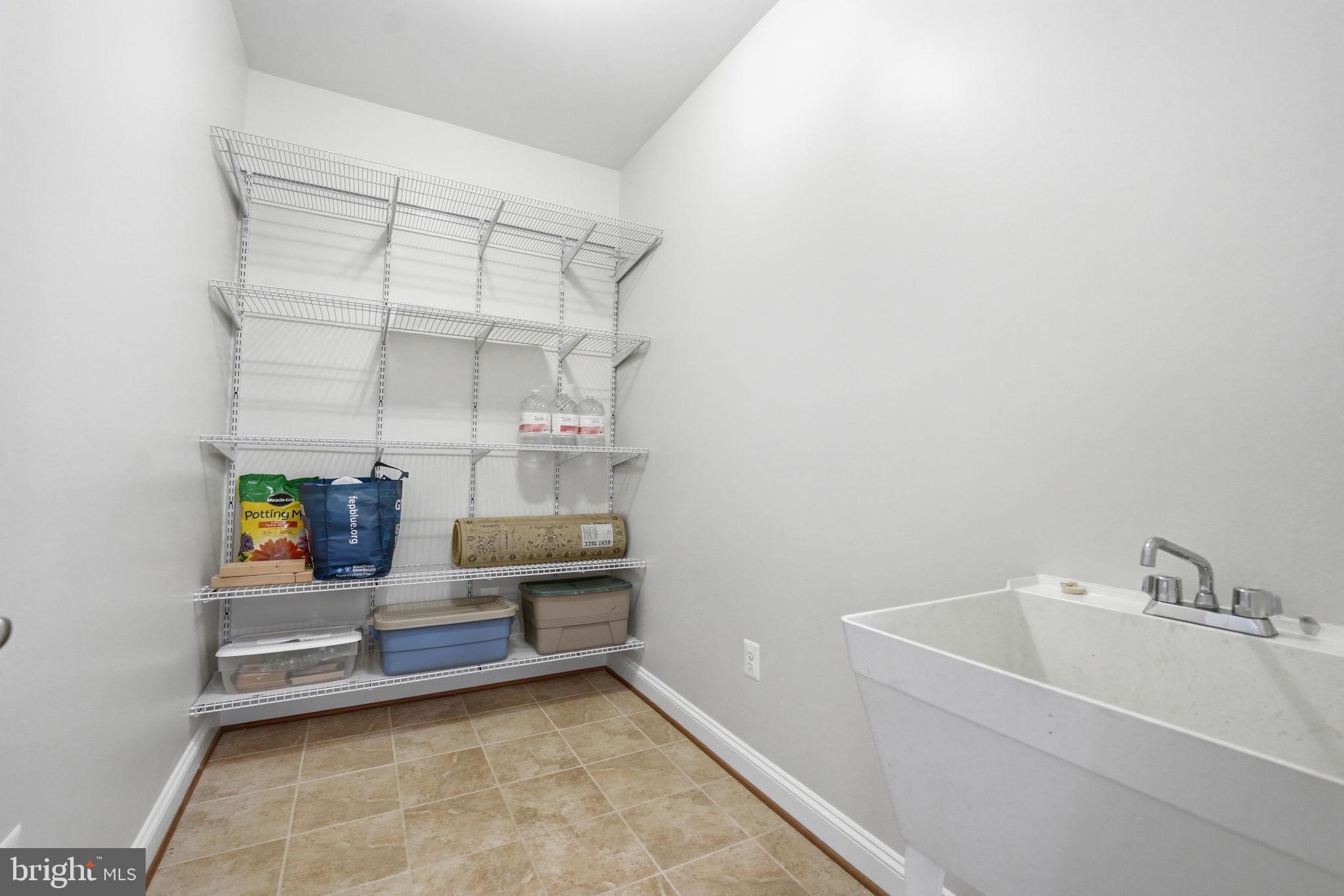13060 Queen Chapel Road Woodbridge, VA 22193 - Photo 26 of 77 Large mud room between kitchen & garage