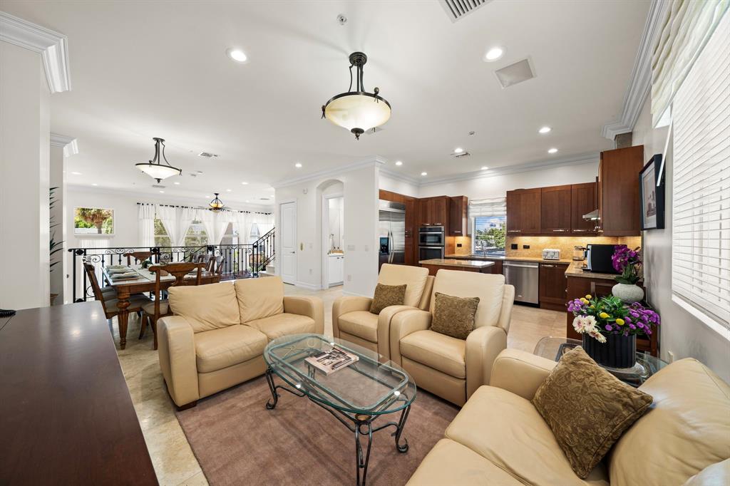 514 North Birch Road Fort Lauderdale, FL 33304 - Photo 17 of 78 a living room with furniture kitchen area and a chandelier
