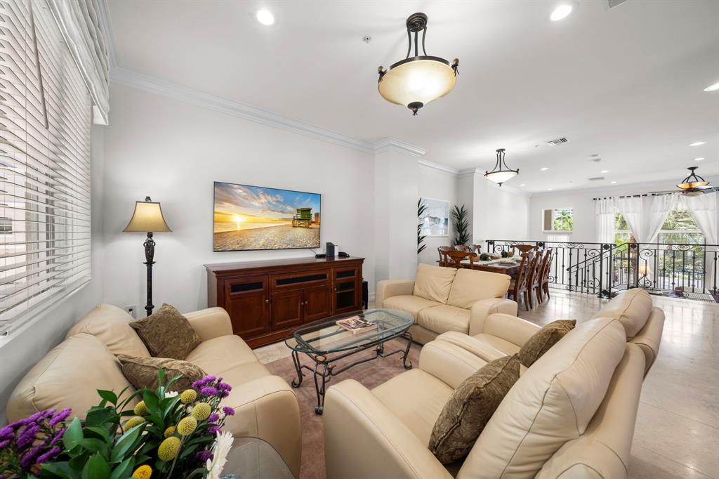 514 North Birch Road Fort Lauderdale, FL 33304 - Photo 18 of 78 a living room with furniture and a flat screen tv