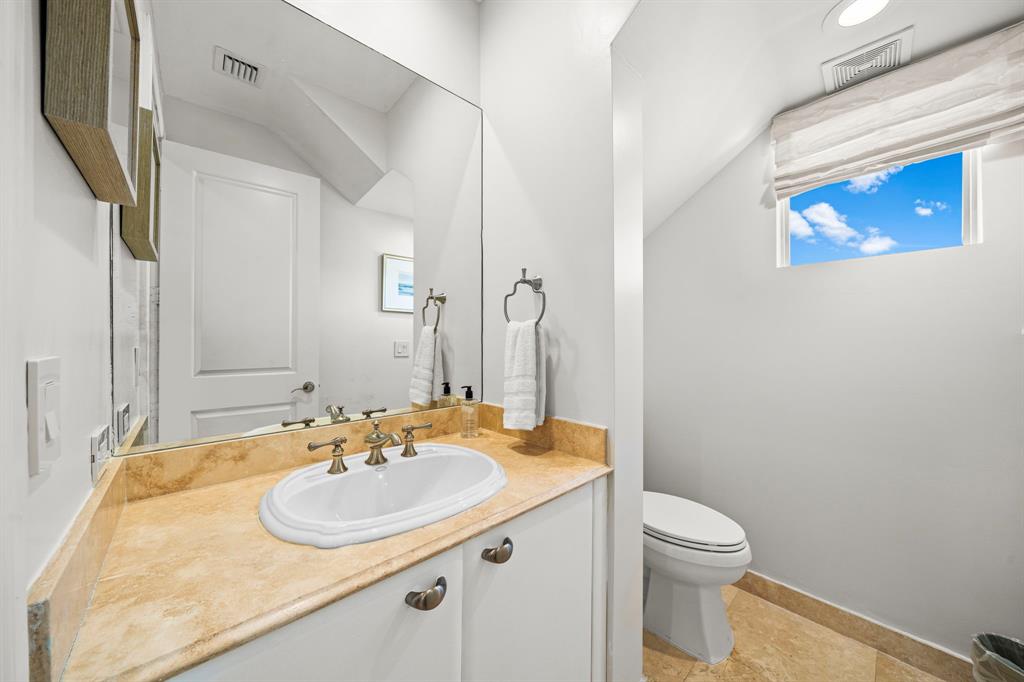 514 North Birch Road Fort Lauderdale, FL 33304 - Photo 19 of 78 a bathroom with a sink and a mirror