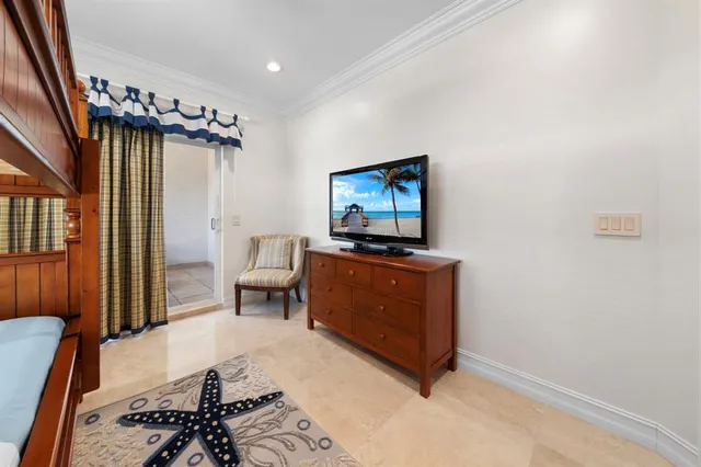 a living room with furniture a fireplace and a large window