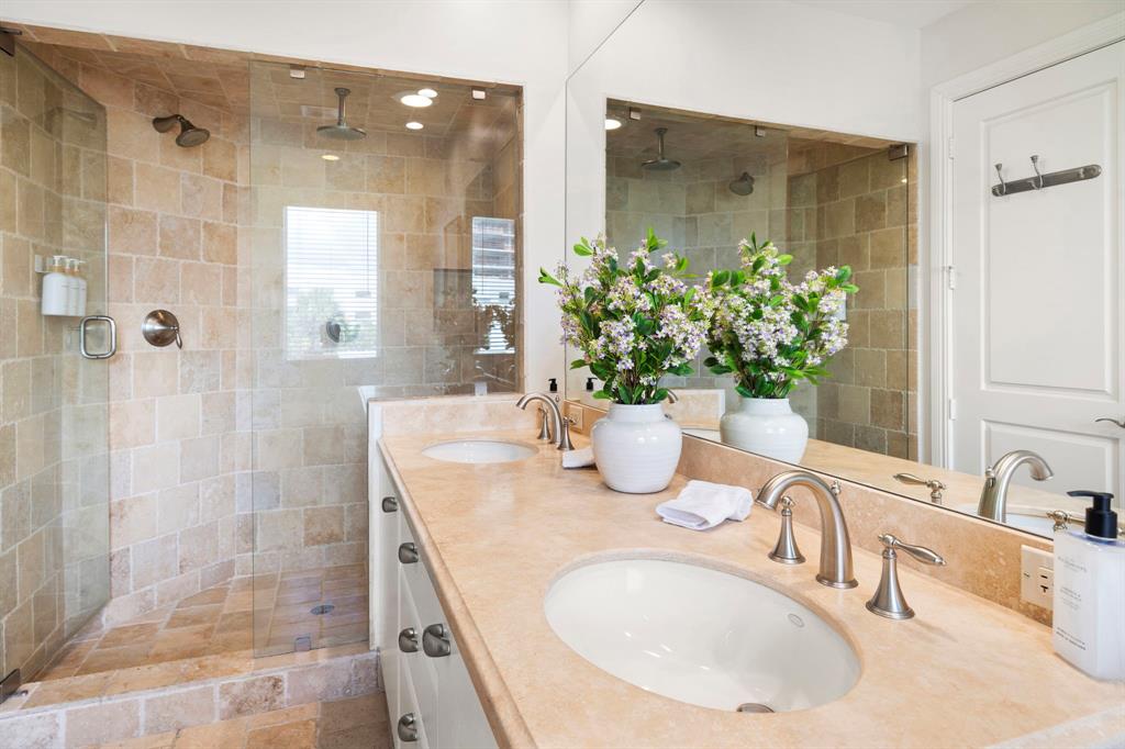 514 North Birch Road Fort Lauderdale, FL 33304 - Photo 37 of 78 a bathroom with a granite countertop sink a shower and a mirror
