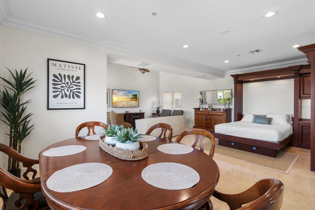 514 North Birch Road Fort Lauderdale, FL 33304 - Photo 47 of 78 a dining room with furniture a rug and a large window