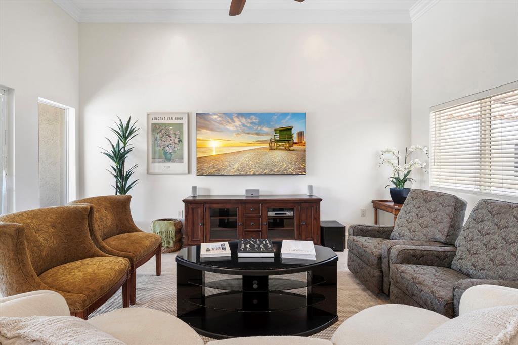 514 North Birch Road Fort Lauderdale, FL 33304 - Photo 48 of 78 a living room with furniture a fireplace and a large window